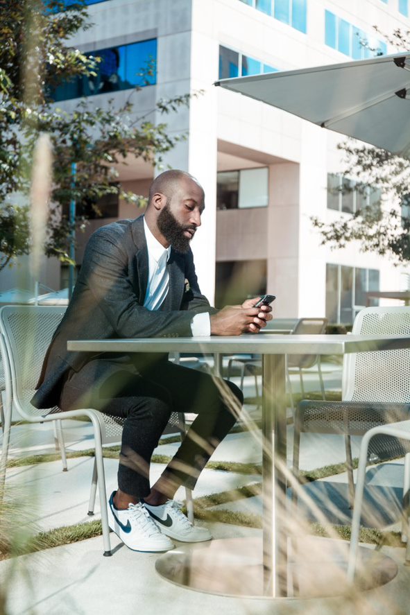 Man typing on cellphone